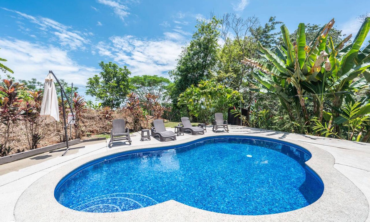 Camaronal House | Modern gated mountain villa in Tarcoles with a private pool, tropical surroundings, fast WiFi, Smart TVs, and spacious indoor living. Perfectly located near Carara National Park, Jacó, Playa Mantas, and Los Sueños Marina.