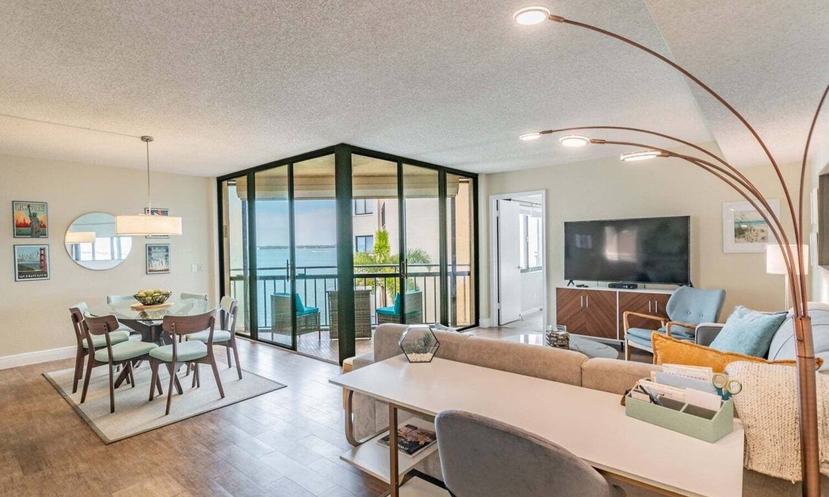 Isla del Sol Condo | Waterfront 2BR/2BA condo with pool, hot tub, balcony, and water views.