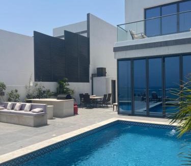 Al Dhaid Villa | سحر المحيط لتأجير بيوت العطلات ocean magic luxury 4BR villa with privet pool, direct sea view,sharm-Al Dana Villa, Al Dana island by ocean magic holiday homes