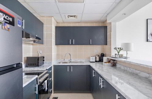 Dubai Sports City Apartment | 1BR flat close to famous The Els Club golf course