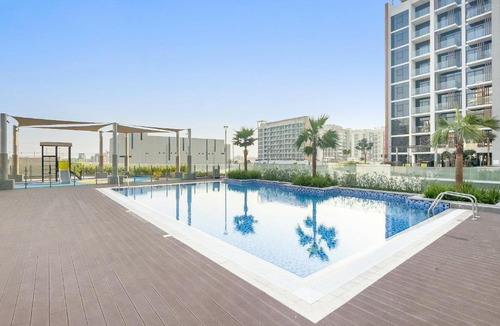 Nad Al Sheba Apartment | Cozy 1BR with Pool View & Balcony