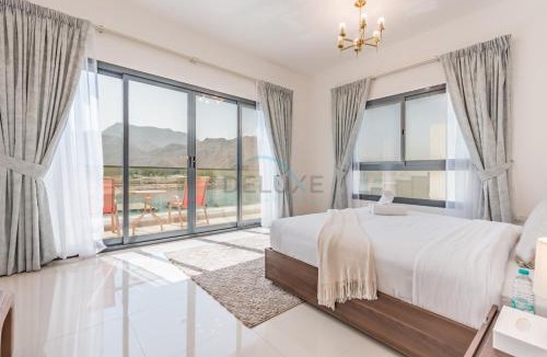 Sharm Apartment | Facing the Sea and Mountains 4BR Villa with Assistant Room and Private Pool, Al Dana Island, Fujairah by Deluxe Holiday Homes