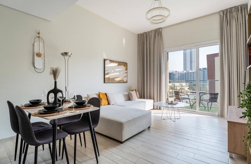 Jumeirah Village Circle Apartment | GuestReady – Bright home large balcony & pool view