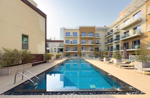 Jumeirah Village Circle Apartment | GuestReady – Bright home large balcony & pool view