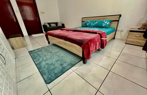 Al Majaz House | Luxury Awaits: Master Bedroom for Rent! Indulge in comfort and style.