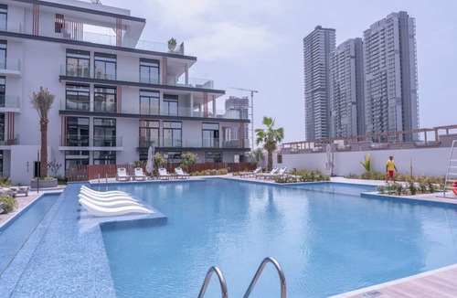 Jumeirah Village Circle Apartment | Relax & Recharge Studio Loft with hanging net