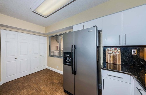 Isla del Sol Condo | Waterfront 2BR/2BA condo with pool, hot tub, balcony, and water views.
