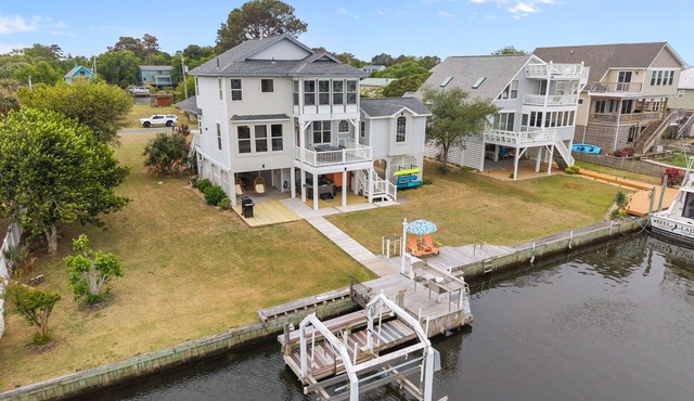 Canal-Front OBX Home w/Dock + Hot Tub/Kayaks/Paddleboards + Bring Your Boat! in Kill Devil Hills
