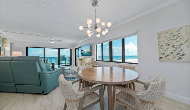 Direct oceanfront southern corner 2/2 condo with large wrap-around balcony and heated pool in New Smyrna Beach