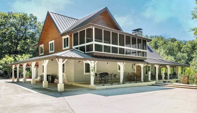 Riverside opulence with game room, private heated pool, hot tub & firepit