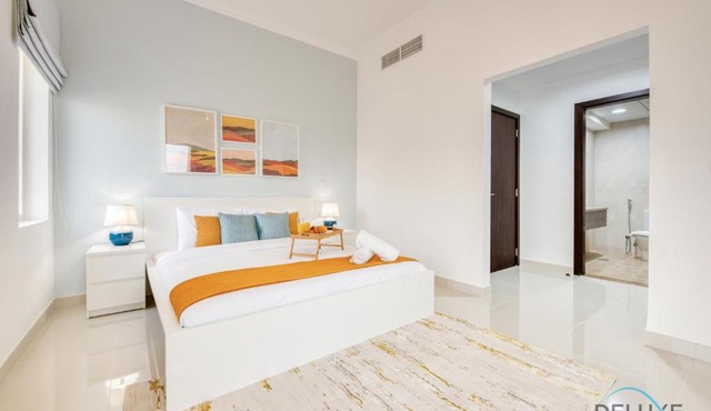 Sunny 1BR at Canal Residences West Dubai Sports City by Deluxe Holiday Homes