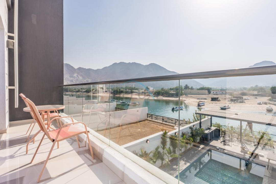 Sharm Apartment | Facing the Sea and Mountains 4BR Villa with Assistant Room and Private Pool, Al Dana Island, Fujairah by Deluxe Holiday Homes
