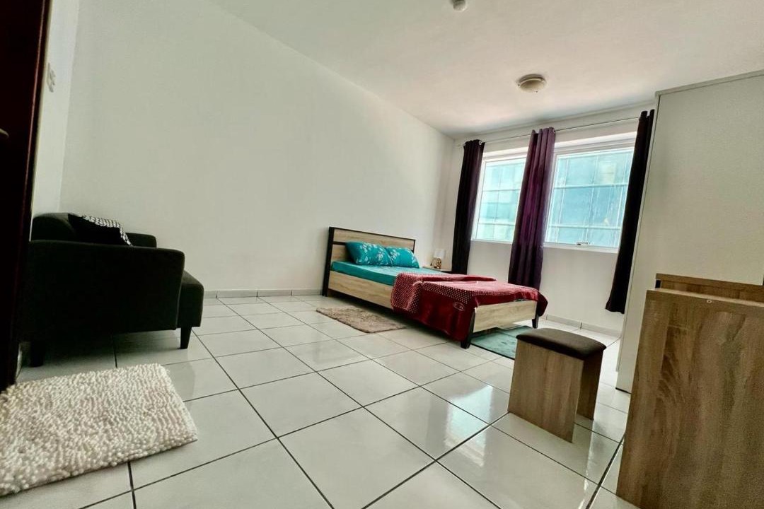 Al Majaz House | Luxury Awaits: Master Bedroom for Rent! Indulge in comfort and style.