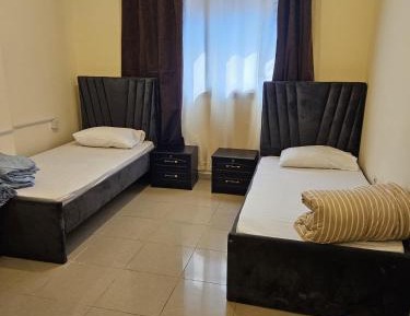 Single Bed in Dormitory Room