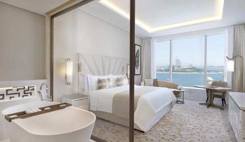 Grand Deluxe King Room with Partial Sea View, KYMA beach access, Signature St. Regis Butler Service