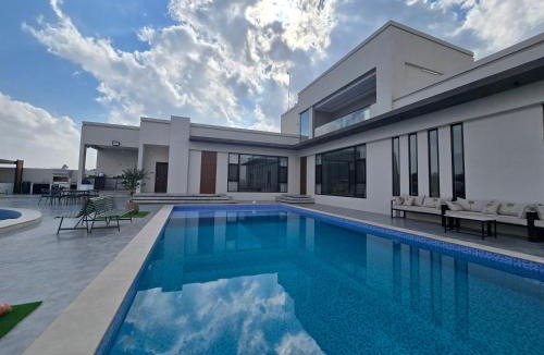 Musannah Resort | Al Tharaa Chalet استراحة الثراء