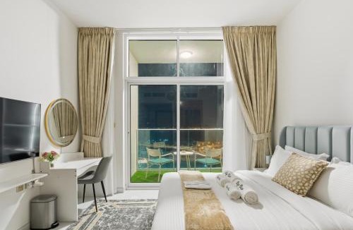 Al Barsha Apartment | Modern Studio on 27th Floor with Miracle Garden Views