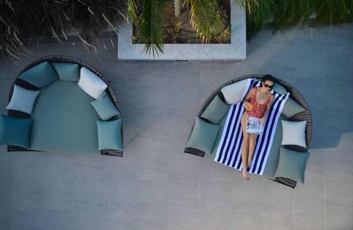 Jumeirah Village Triangle Apartment | Vogue Vacation Homes, Novotel Residences JVT near Springs Souk Mall, One Bedroom apartment with Balcony and Vibrant Community View, Access to all Amenities