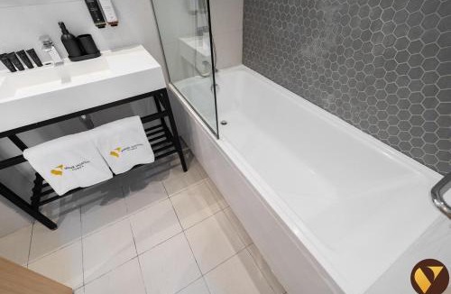 Jumeirah Village Triangle Apartment | Vogue Vacation Homes, Novotel Residences JVT near Springs Souk Mall, One Bedroom apartment with Balcony and Vibrant Community View, Access to all Amenities