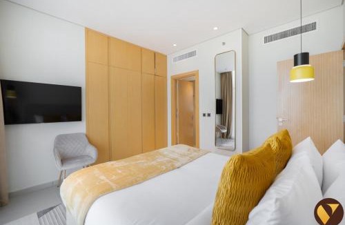 Jumeirah Village Triangle Apartment | Vogue Vacation Homes, Novotel Residences JVT near Springs Souk Mall, One Bedroom apartment with Balcony and Vibrant Community View, Access to all Amenities