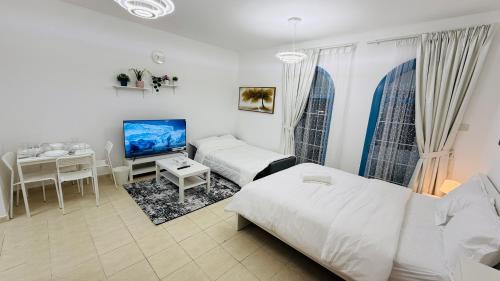 International City Apartment | O07 Luxury Furnished Studio Apartment near bus stop Garden view Persia Cluster