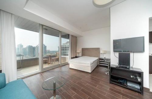 Dubai Sports City Apartment | StoneTree - Spacious Studio - The Matrix